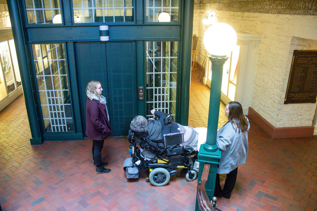 Alexia Kemerling, Maria Matzik and her care worker  waiting for the only accessible elevator available to Maria to go to the hearing room